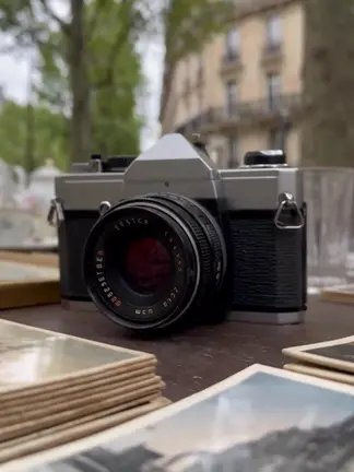 A vintage camera on a wooden table